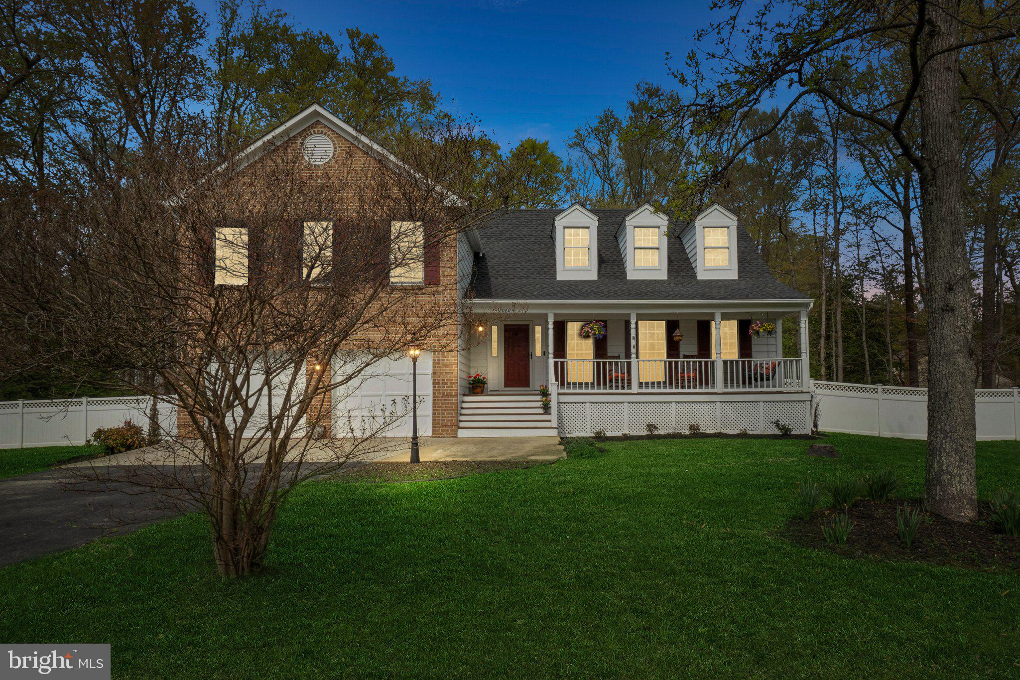 10604 Cannonview Court Fort Washington, MD 20744 - Photo 2 of 50 a front view of a house with a garden