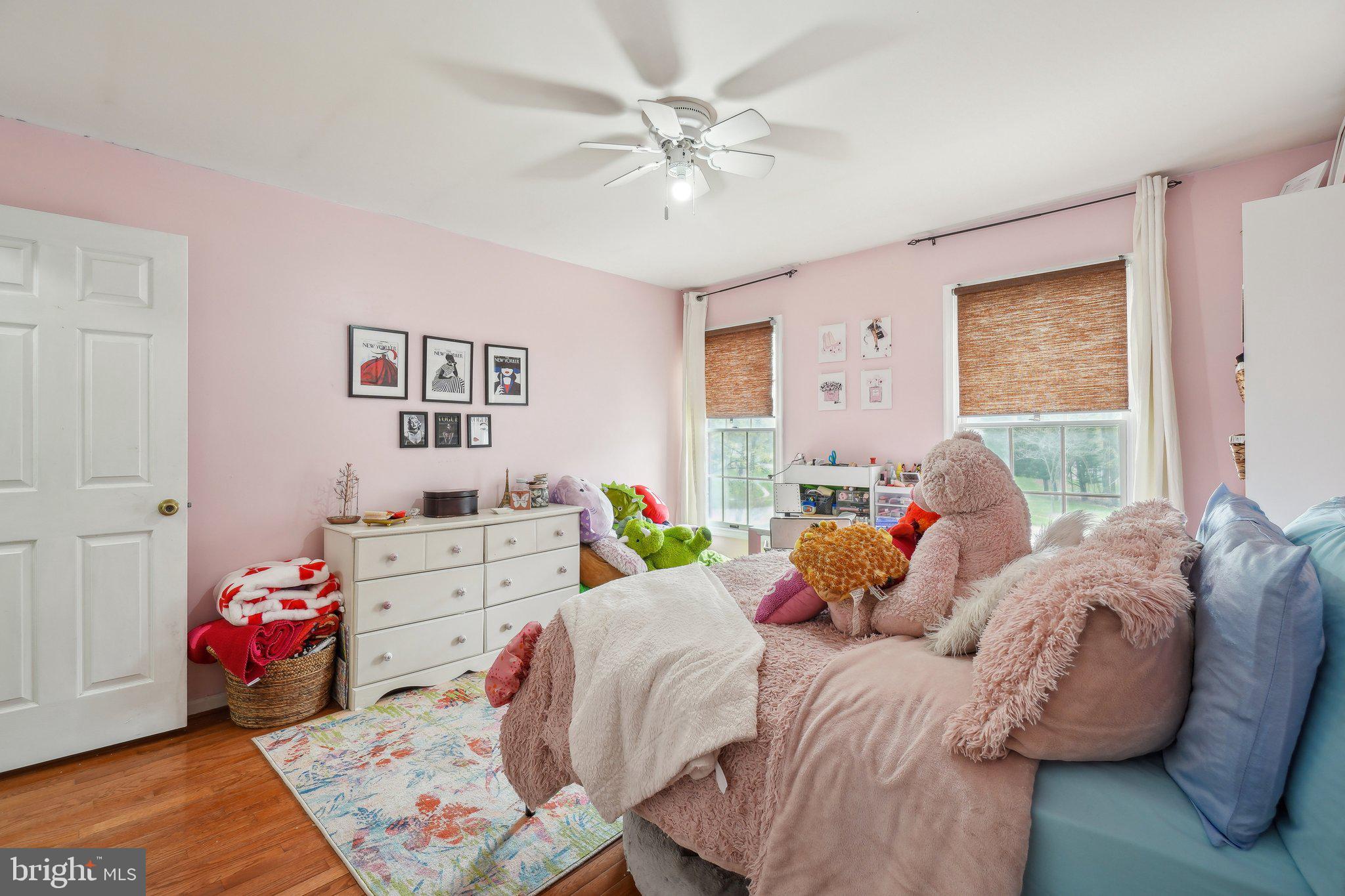 10604 Cannonview Court Fort Washington, MD 20744 - Photo 23 of 50 a bedroom with two beds and a chandelier