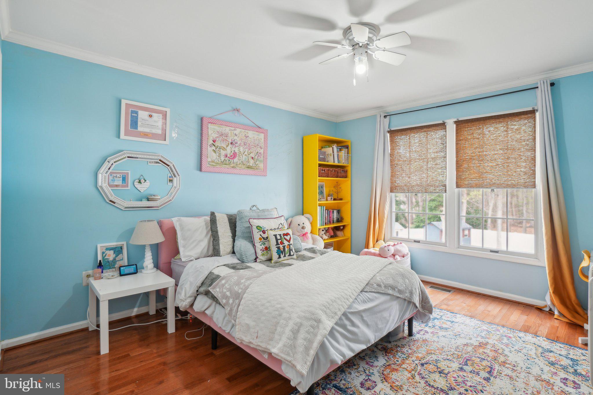 10604 Cannonview Court Fort Washington, MD 20744 - Photo 26 of 50 a bedroom with a bed and a table in it with window