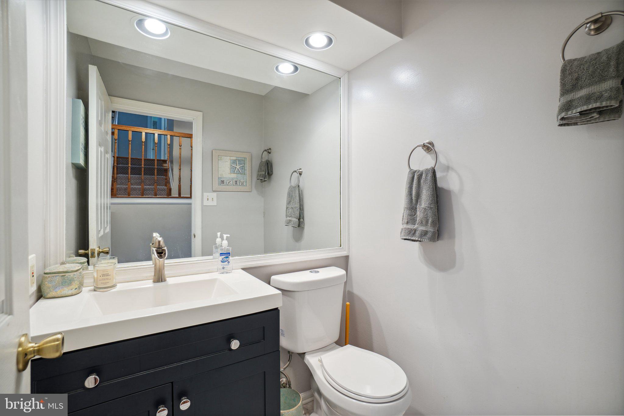 10604 Cannonview Court Fort Washington, MD 20744 - Photo 28 of 50 a bathroom with a sink a toilet a mirror and shower