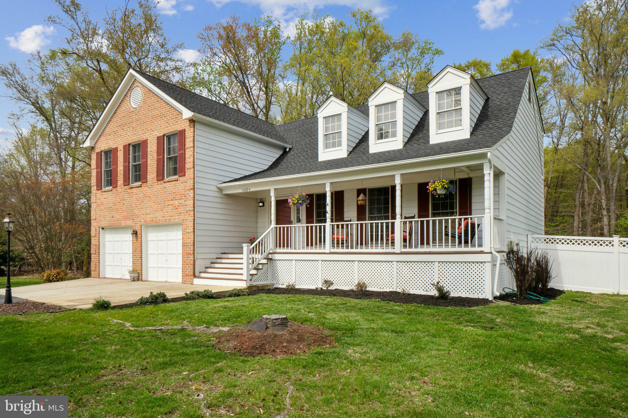 10604 Cannonview Court Fort Washington, MD 20744 - Photo 3 of 50 a front view of a house with a yard