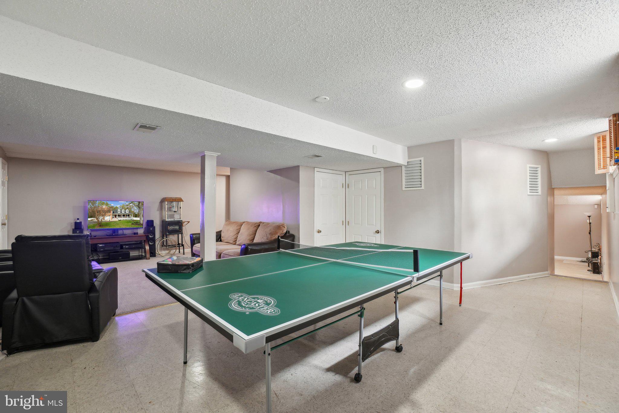 10604 Cannonview Court Fort Washington, MD 20744 - Photo 31 of 50 a room with pool table and flat screen tv