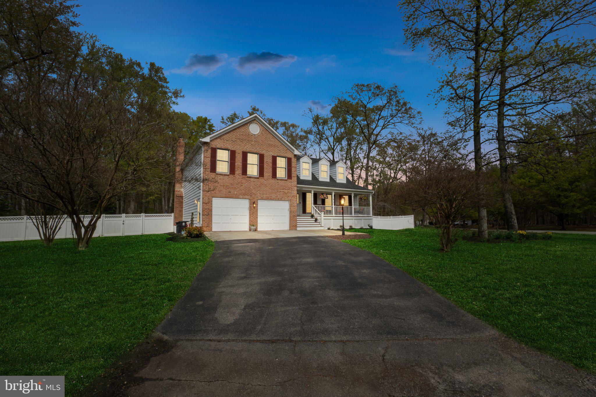 10604 Cannonview Court Fort Washington, MD 20744 - Photo 40 of 50 a front view of a house with a yard and trees