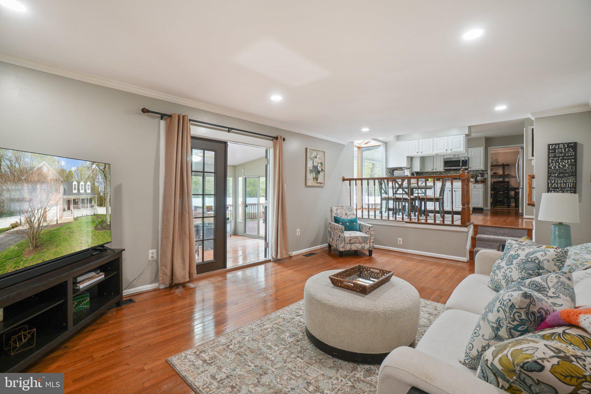10604 Cannonview Court Fort Washington, MD 20744 - Photo 7 of 50 a living room with furniture and a flat screen tv