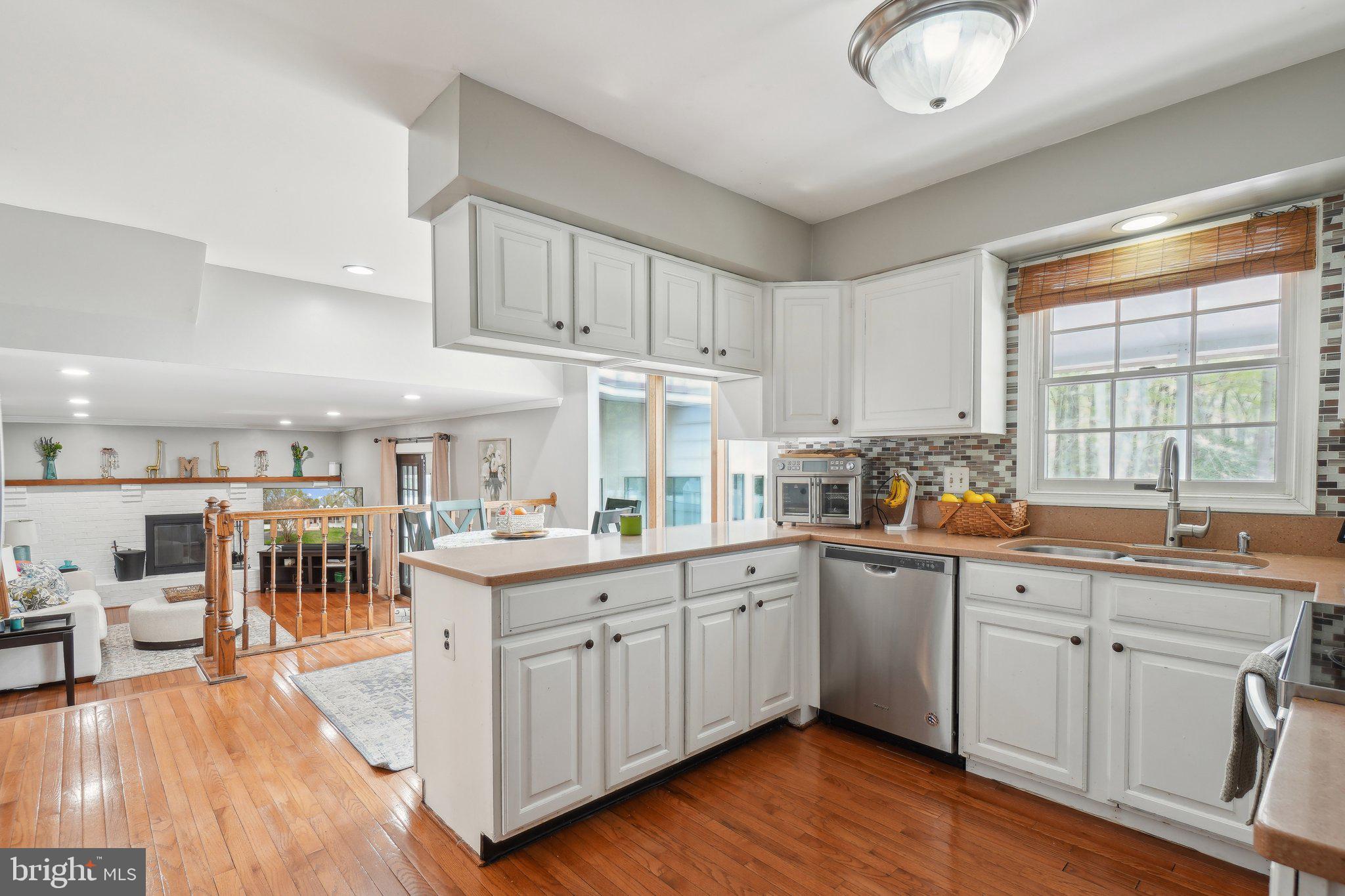 10604 Cannonview Court Fort Washington, MD 20744 - Photo 8 of 50 a kitchen with cabinets a sink and appliances