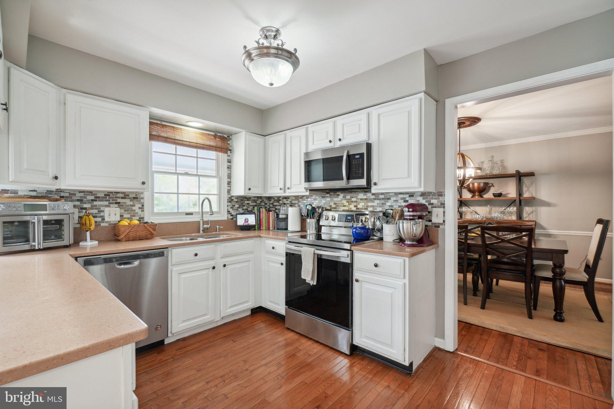 10604 Cannonview Court Fort Washington, MD 20744 - Photo 9 of 50 a kitchen with cabinets a sink and appliances