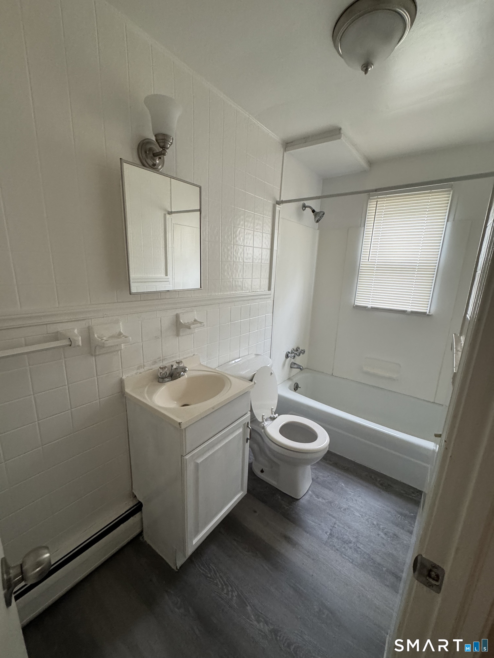 68 Warner Street, Unit B2 Hamden, CT 06514 - Photo 5 of 6 a bathroom with a sink a bathtub and a shower