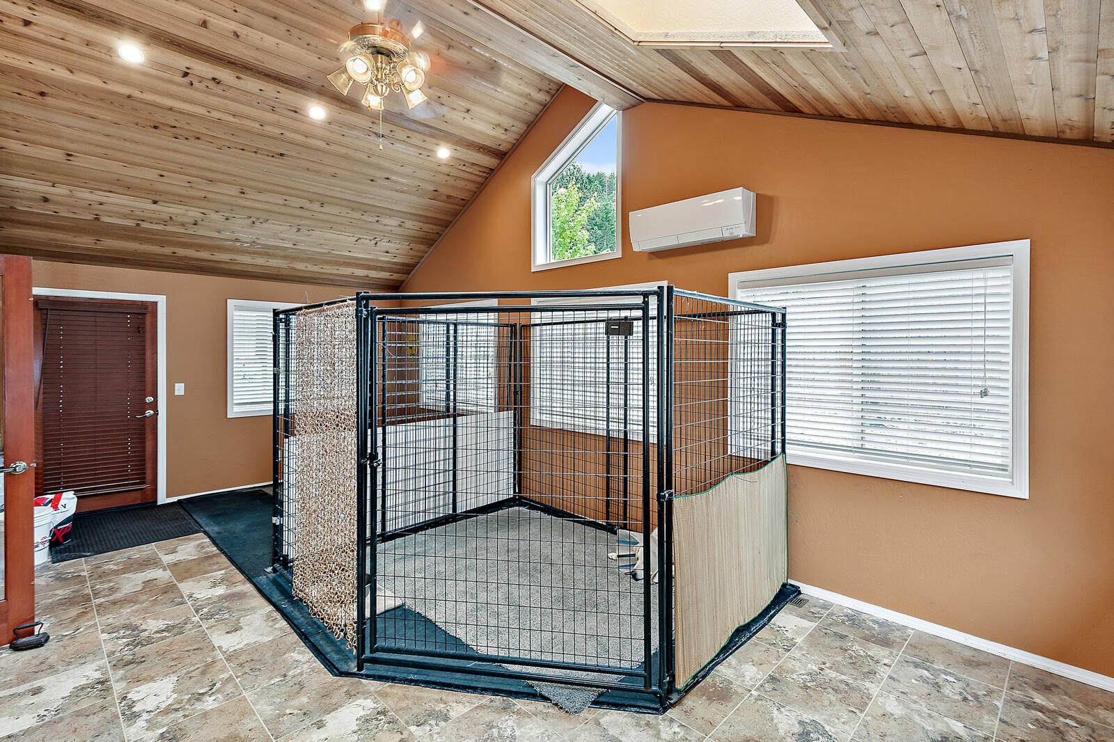 9250 Wagner Creek Road Talent, OR 97540 - Photo 16 of 52 Large sunroom addition with front and rear exterior access and mini split for heating and air.