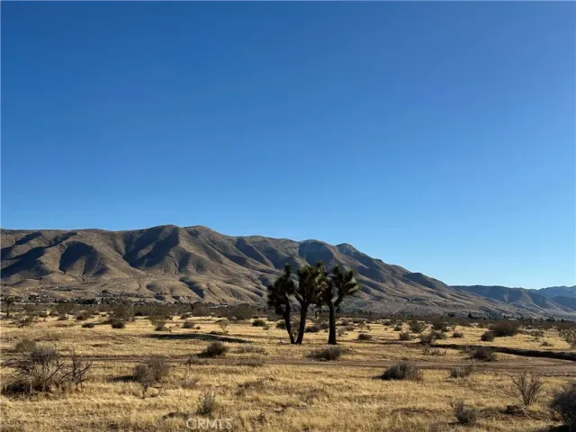 a view of ocean with mountains
