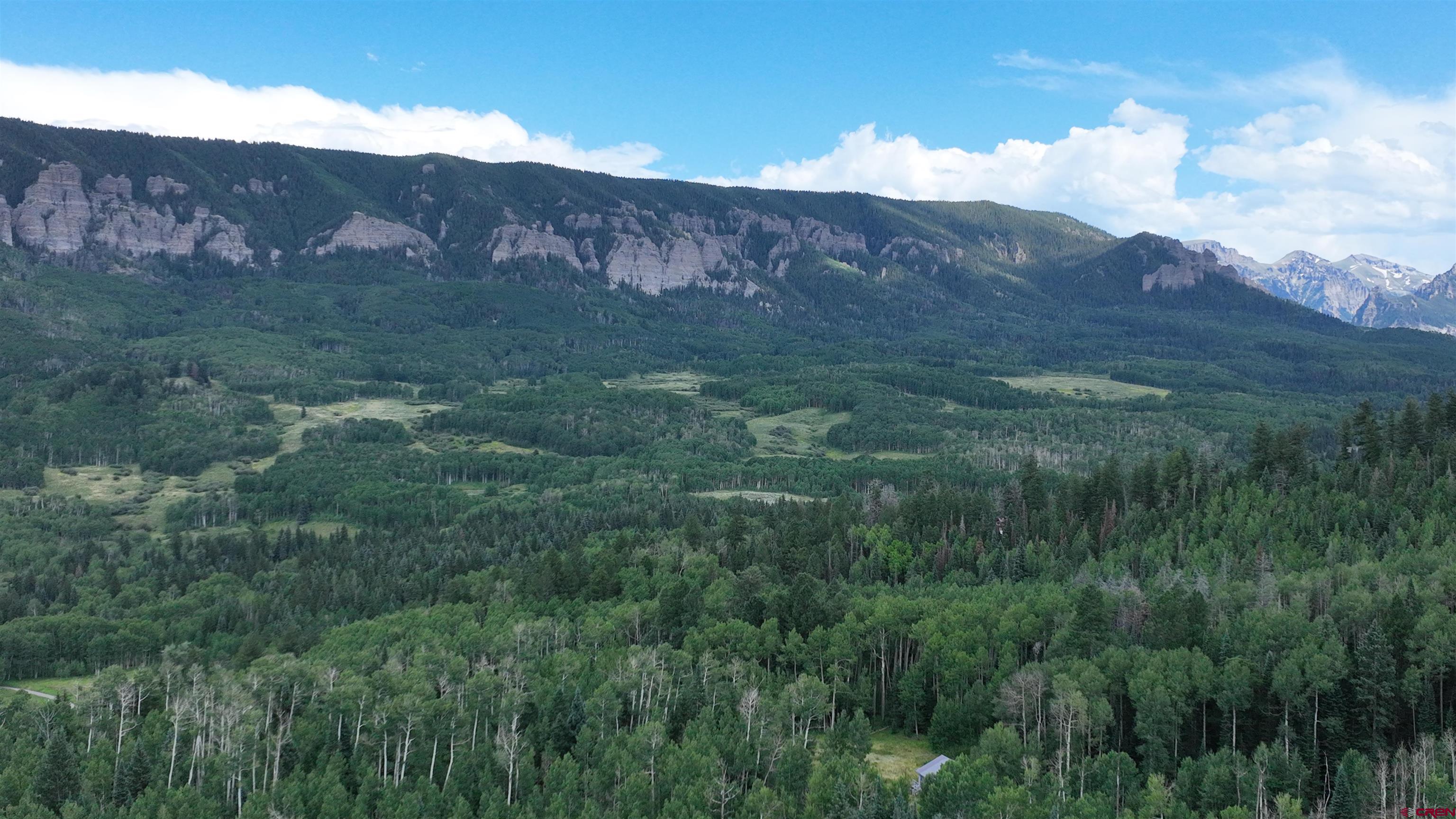 1073 Hampton Road Montrose, CO 81403 - Photo 21 of 26 a view of a lush green hillside and a mountain
