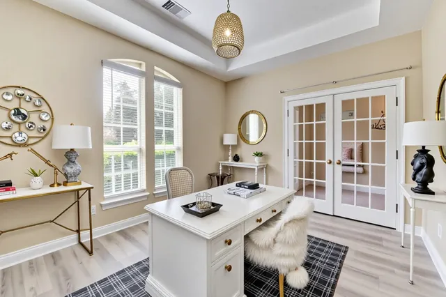 a view of a dining room with furniture window and wooden floor
