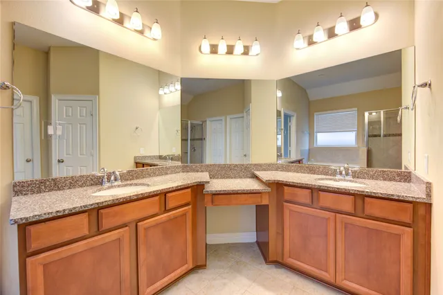a bathroom with a bathtub and shower