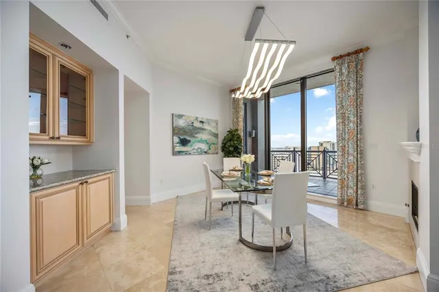 a dining room with furniture and window