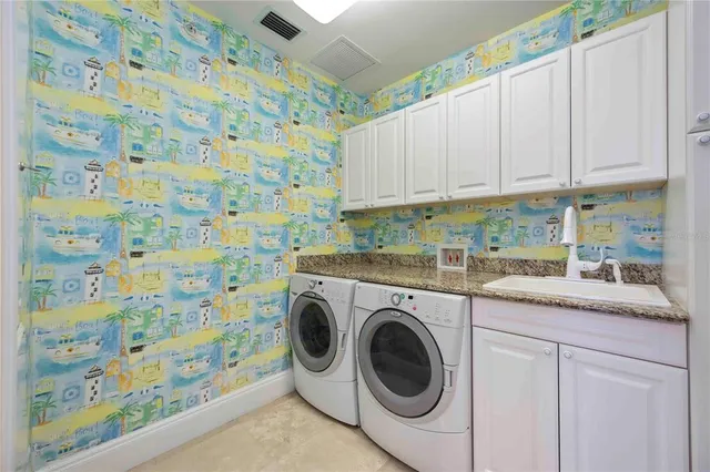 a bedroom with a large bed and a potted plant
