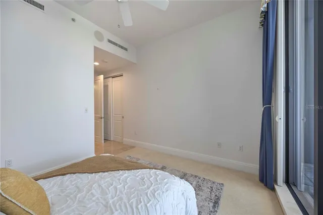 a room with a table chairs and a workspace