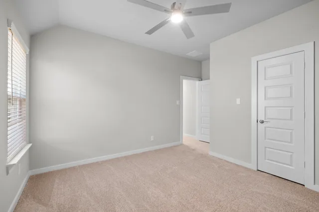 an empty room with a empty space and a window