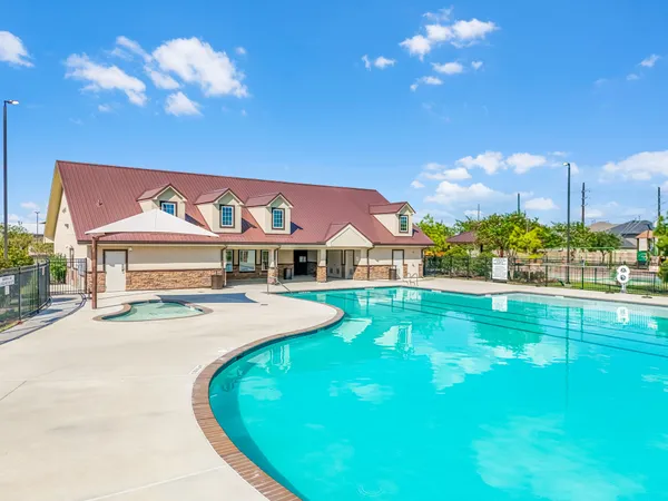 a view of an house with swimming pool yard and outdoor seating