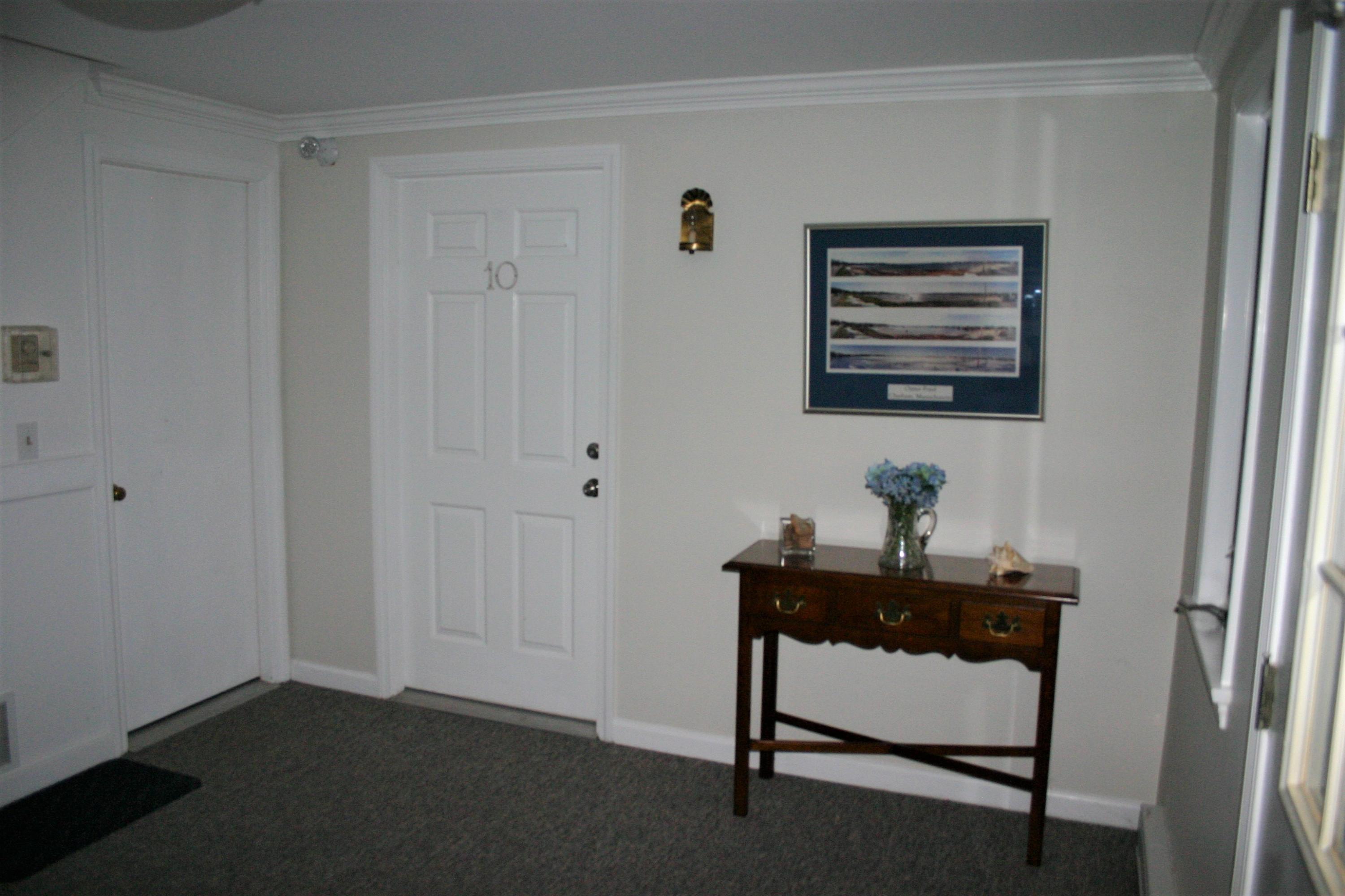 93 Depot Road, Unit 10 Chatham, MA 02633 - Photo 2 of 16 a view of a workspace with furniture