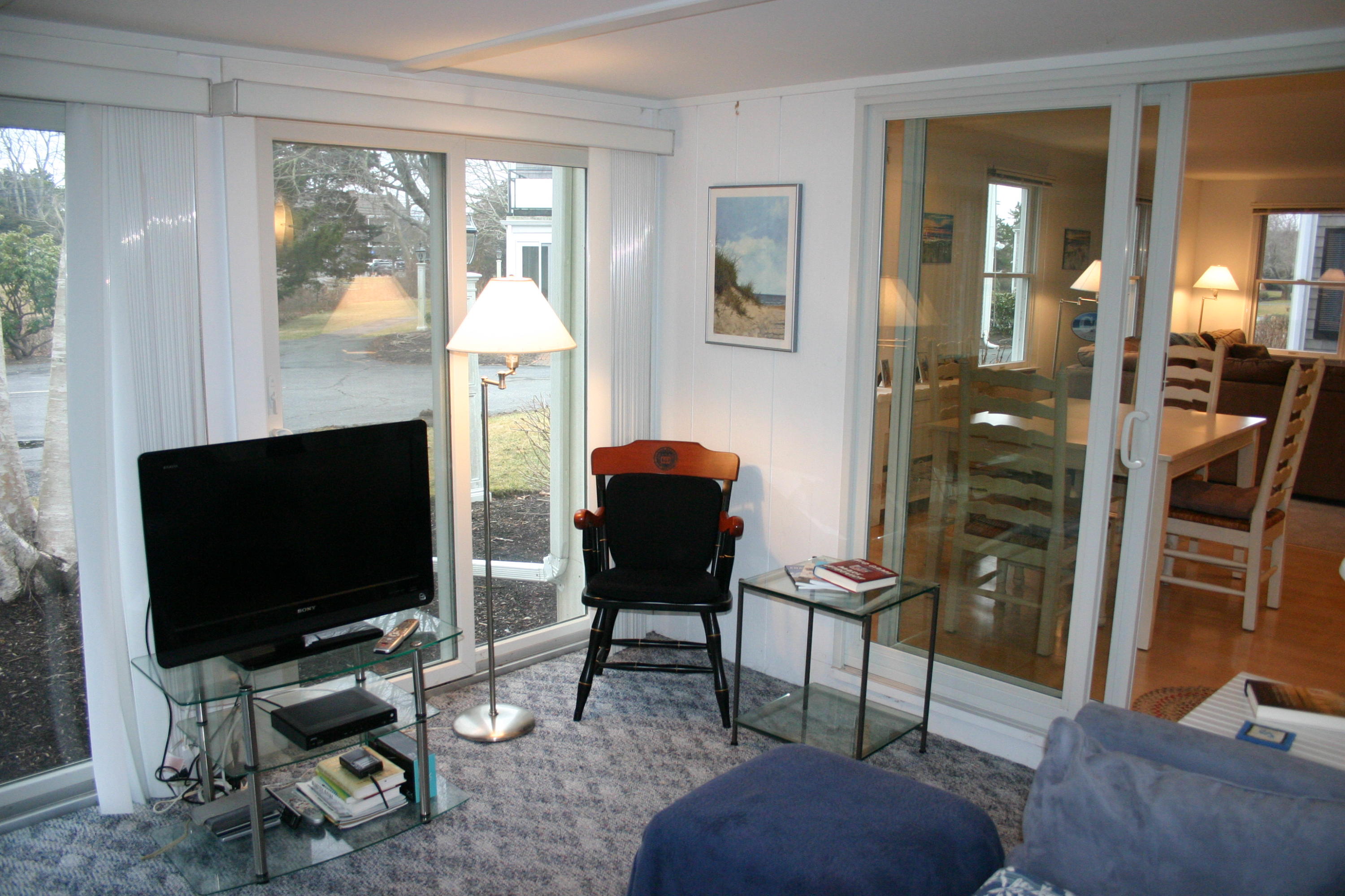93 Depot Road, Unit 10 Chatham, MA 02633 - Photo 9 of 16 a living room with furniture and a flat screen tv