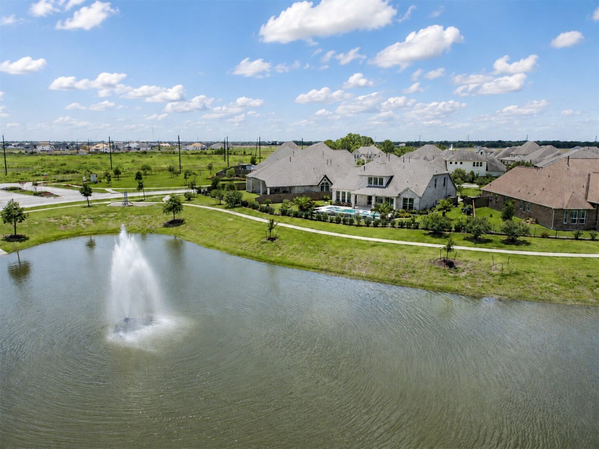 4343 Martin Ridge Drive Manvel, TX 77578 - Photo 49 of 50 a view of a lake with houses in the back