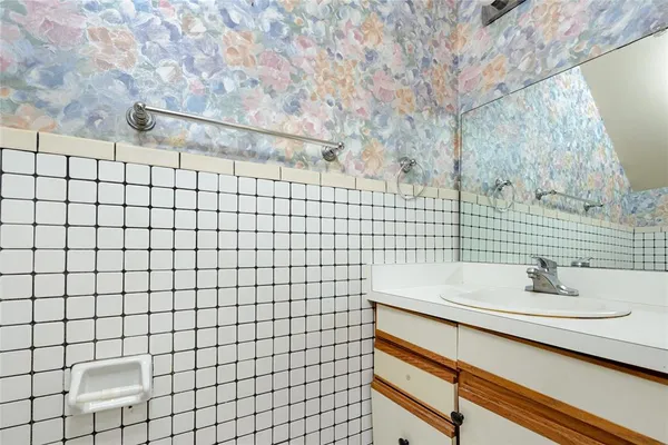 a bathroom with a sink and a shower
