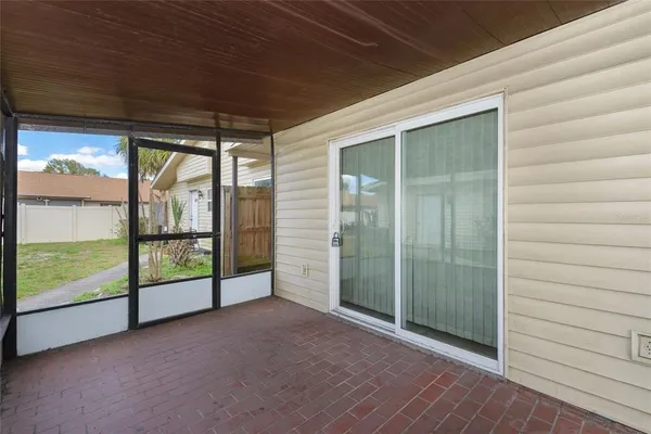 a view of a room with sliding glass door