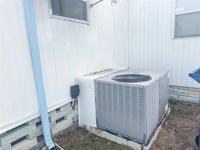 a view of a swimming pool with an outdoor seating