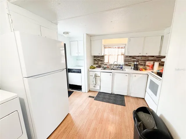 a view of a swimming pool with an outdoor seating and deck