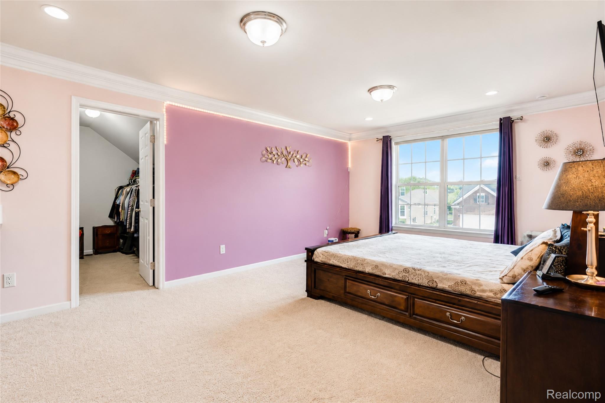 50873 Scarborough Road Canton, MI 48188 - Photo 17 of 33 Carpeted room featuring a double-paned window, crown molding, and recessed lighting