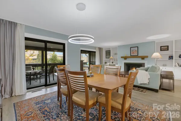 a view of a livingroom with furniture and a fireplace
