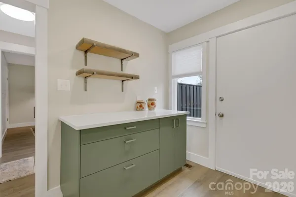 a living room with furniture and a wooden floors
