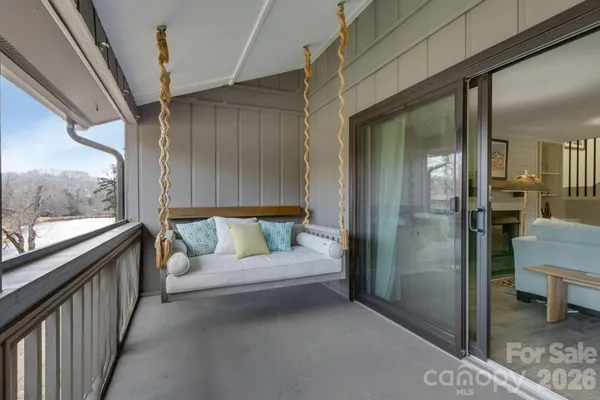 a view of livingroom with furniture and window