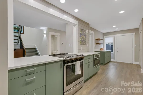 a kitchen with a stove and a sink