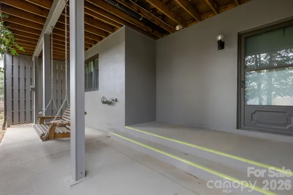 a backyard of a house with lots of green space