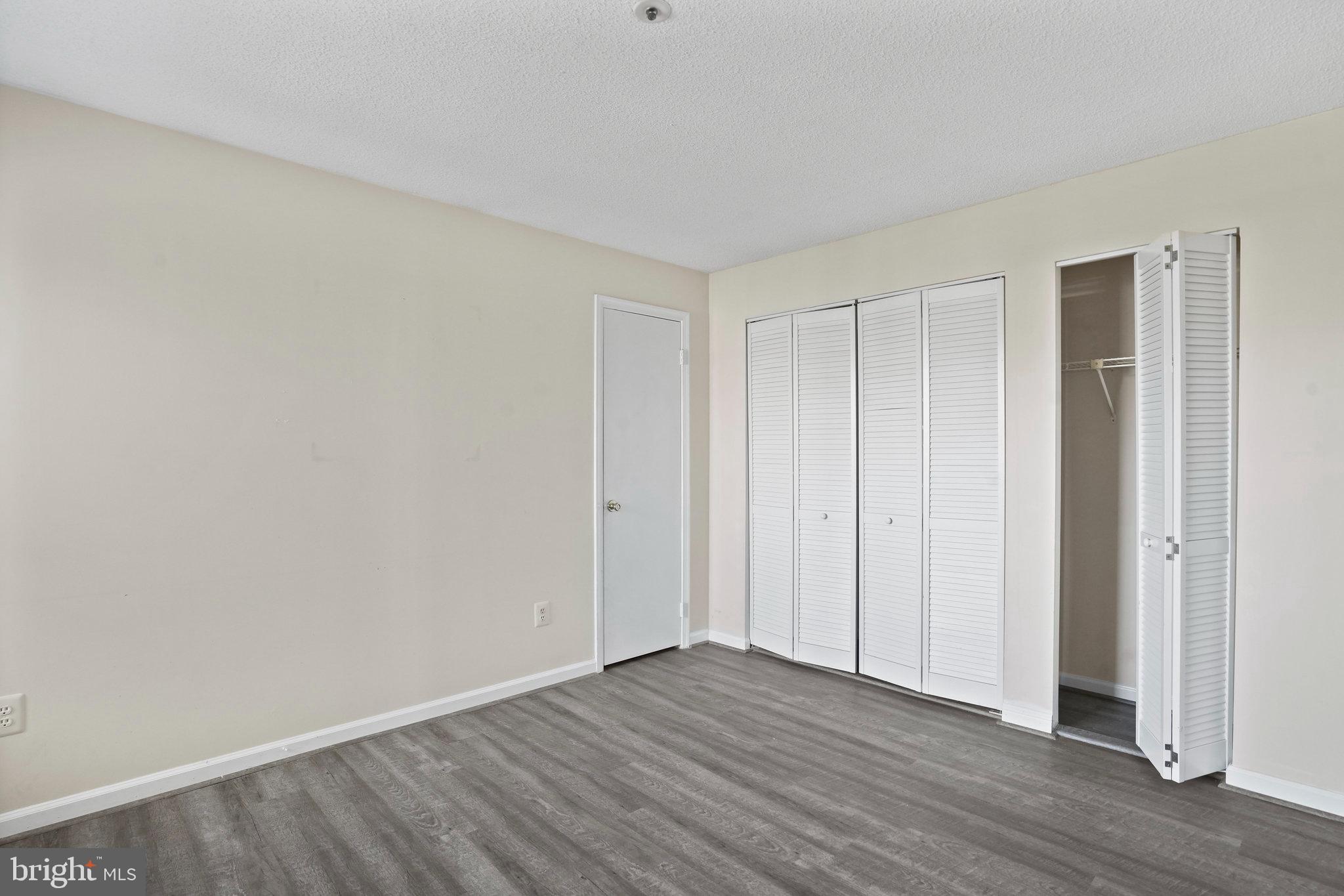 14023 Vista Drive, Unit 89 Laurel, MD 20707 - Photo 16 of 26 a view of an empty room with wooden floor