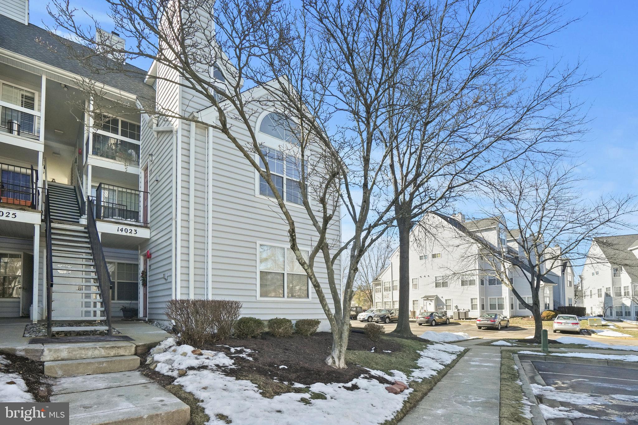 14023 Vista Drive, Unit 89 Laurel, MD 20707 - Photo 19 of 26 a front view of a building with trees