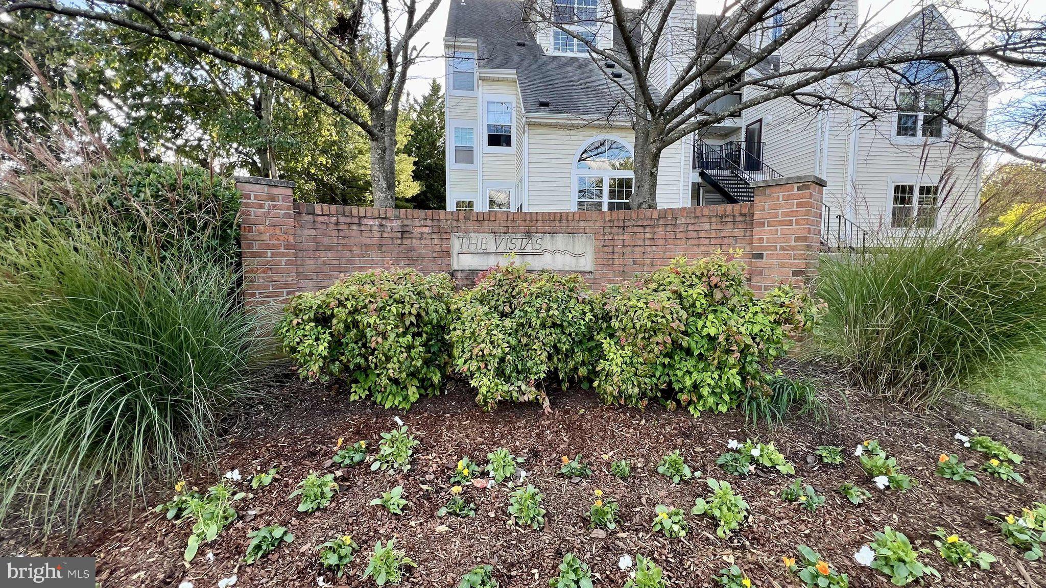 14023 Vista Drive, Unit 89 Laurel, MD 20707 - Photo 21 of 26 a view of a house with a yard