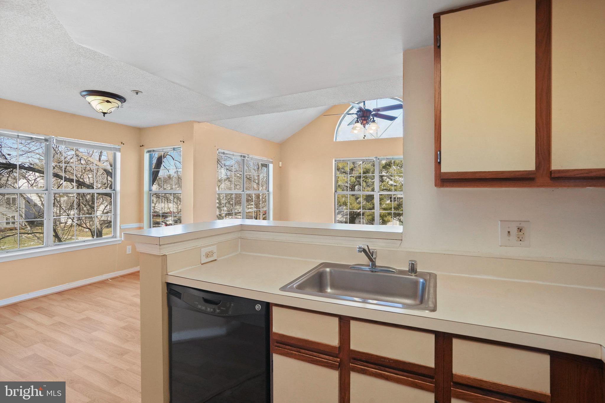 14023 Vista Drive, Unit 89 Laurel, MD 20707 - Photo 7 of 26 a kitchen with a sink and a window