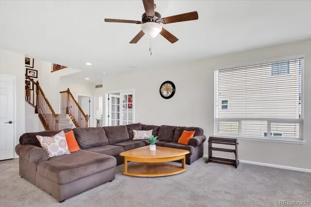 a living room with furniture and a window
