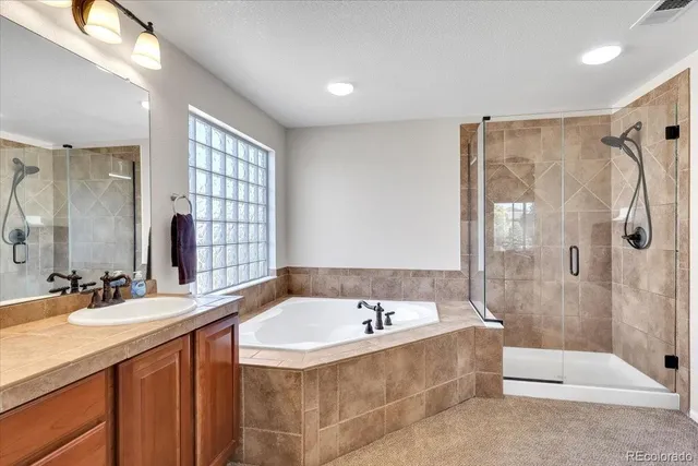 a bathroom with a bathtub and a sink