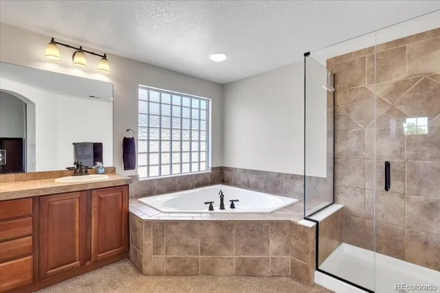 a bath tub sitting in a bathroom next to a window