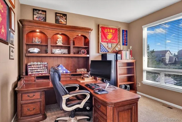 a view of a workspace with furniture