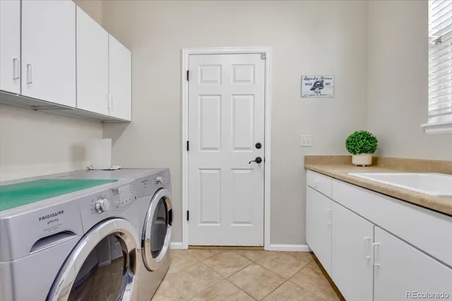 a view of storage and utility room with washer and dryer