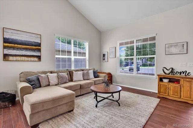 a living room with furniture and windows