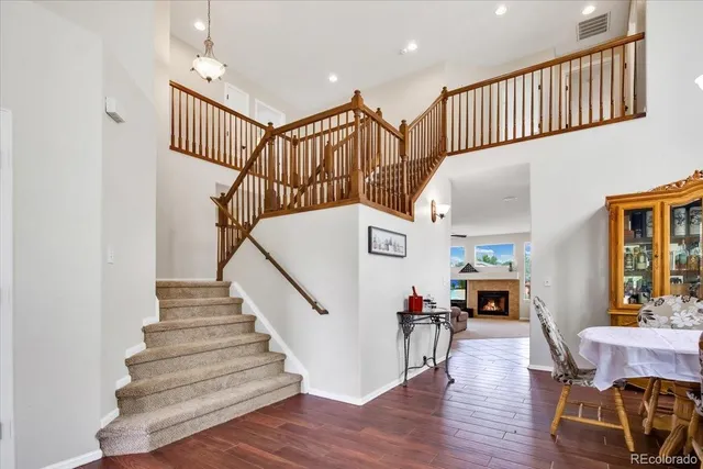 a view of entryway livingroom and hall with wooden floor