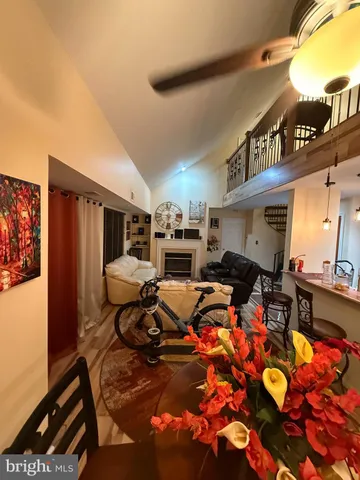 a view of living room with furniture and flat screen tv