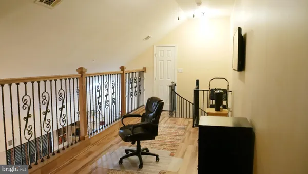a view of a balcony with chairs