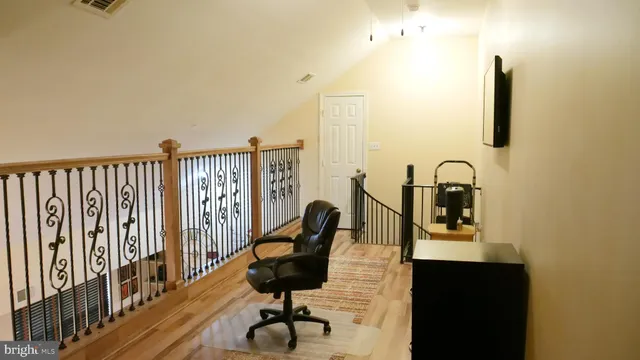 a view of a balcony with chairs