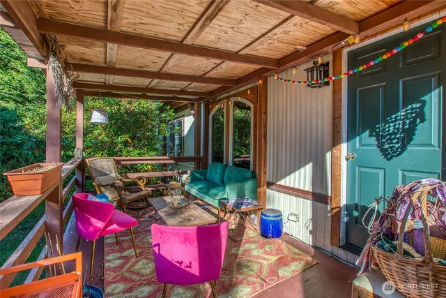 a view of a yard with plants and trees