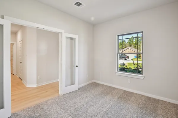 an empty room with windows